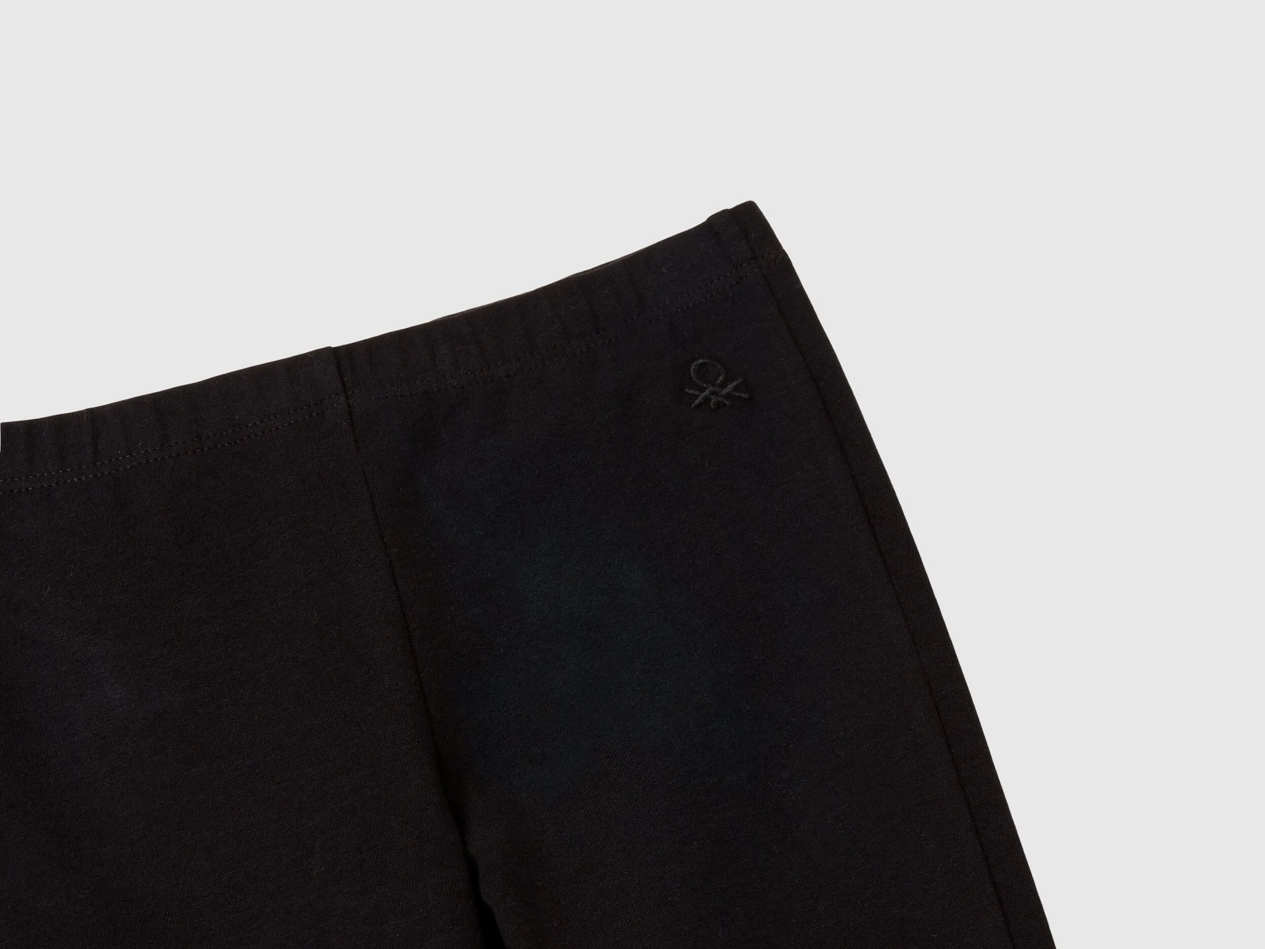 Stretch cotton black flared leggings by Benetton.